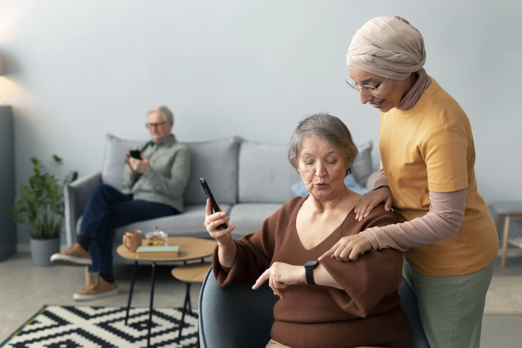 A nurse showing patient how to use healthcare smart device